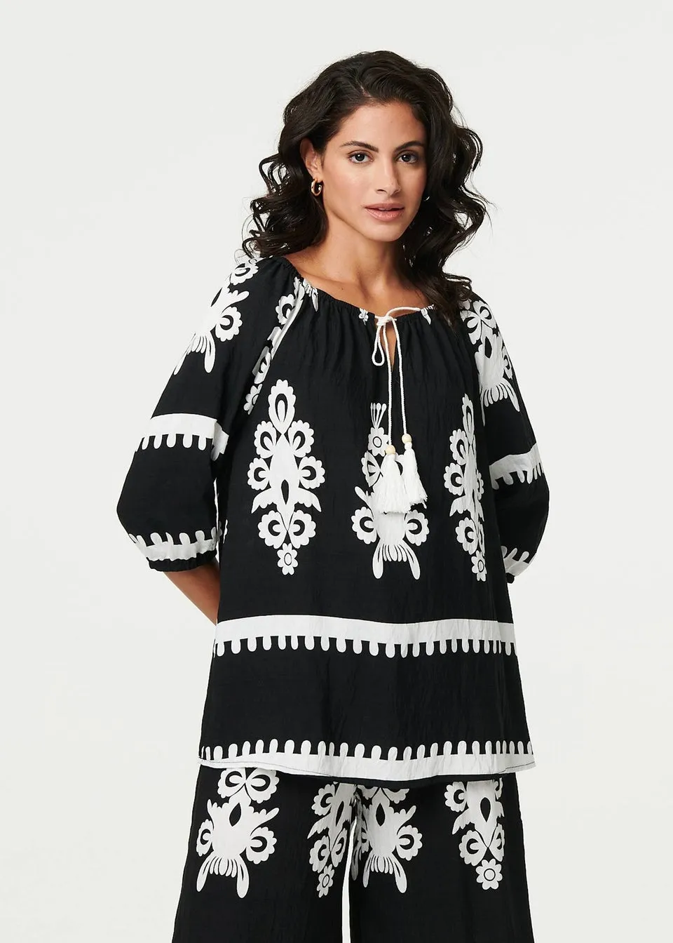 Izabel London Black Ikat Print Tassel Tie Neck Blouse