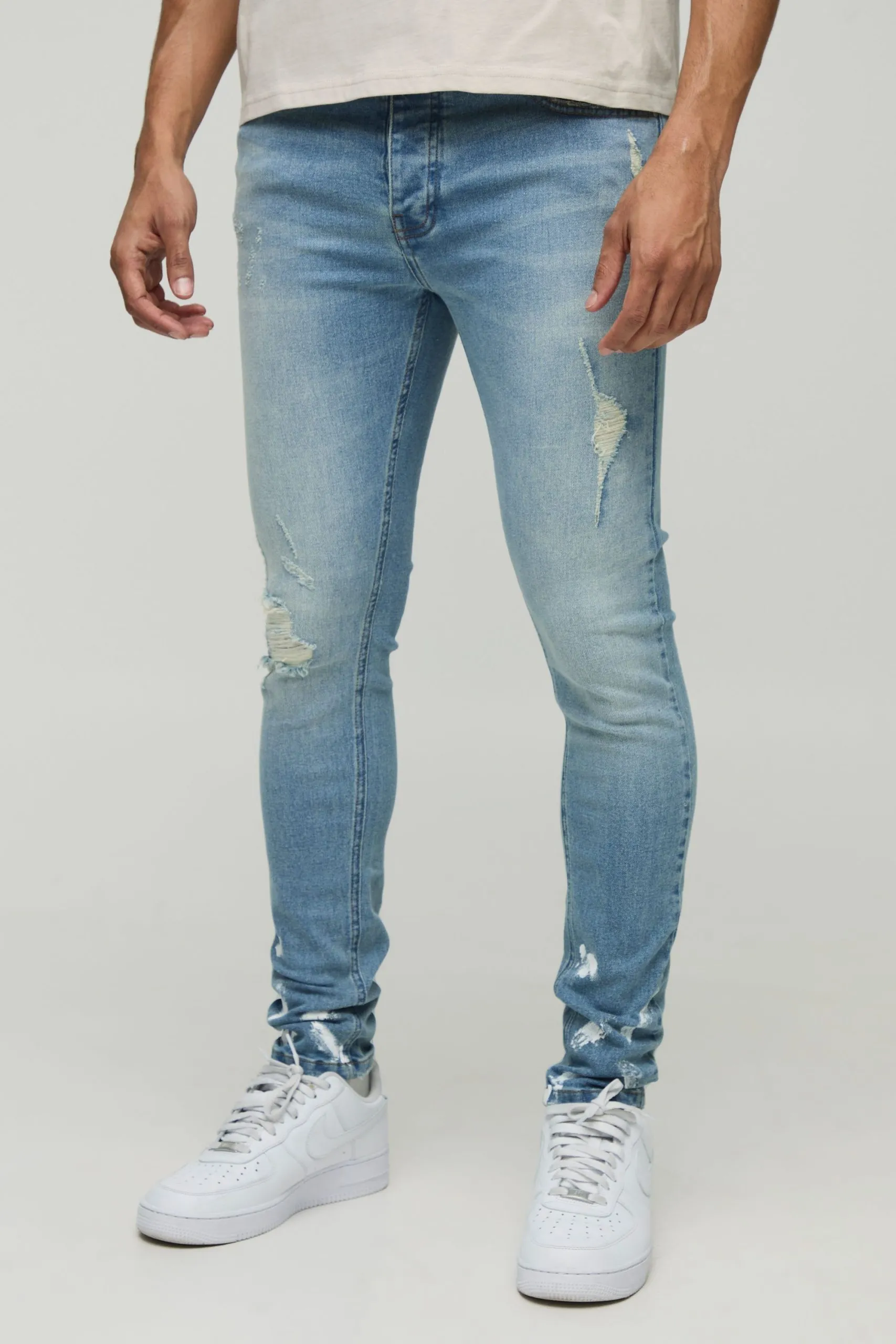 Skinny Stretch Ripped Paint Splatter Hem Jeans